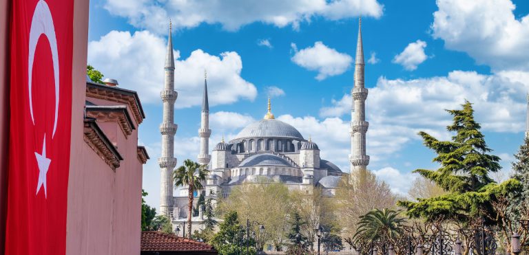 Landscape of the Turkish flag and The Blue Mosque far away